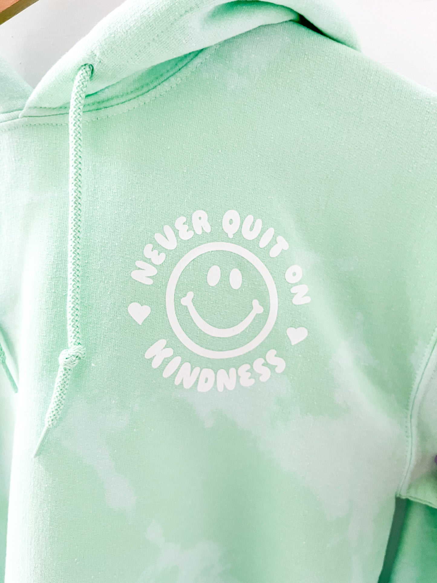 "Never Quit on Kindness" Hoodie | Green Dye Effect